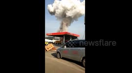Massive explosion sends huge mushroom cloud of smoke into air at firecrackers factory