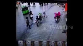 Woman struck by electric bus in China