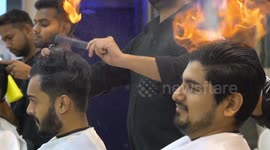 Indian barber cuts men’s hair by setting it on FIRE 