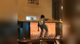 Young Eagles fan cheered as he dances to rapper Meek Mill on top of car