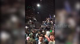 Eagles fans jump on cars and vandalize street light after Super Bowl win