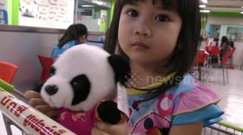 Thai girl loves panda doll
