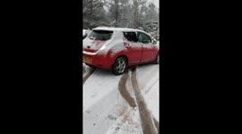 Nissan leaf electric car stuck in snow