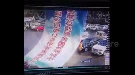 Giant billboard collapses on top of woman carrying child