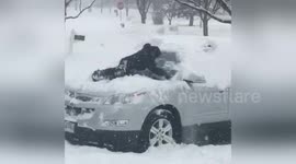 Newsflare Edit - Boy uses his body instead of a brush during Chicago snowstorm
