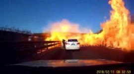Truck bursts into fire after turning over in north China