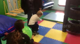 3yr old John, a trach child, receives weekly therapy to help him with coordination
