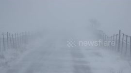 Snow Blowing Across Road