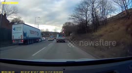 Police car & flatbed truck almost collide at Tinsley roundabout, Sheffield.