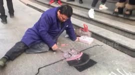 Cartoonist creates intricate street drawings with chalk