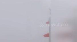 Newsflare Edit - Airplane landing in fog