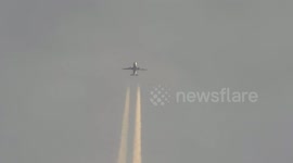 flying airplane close up from ground