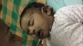 Sleeping baby smiles when mum says 'I love you' to her