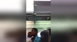 Newsflare Edit - Police escort off the plane.