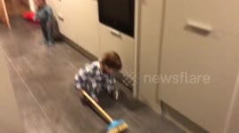 Toddler recreates Winter Olympic curling
