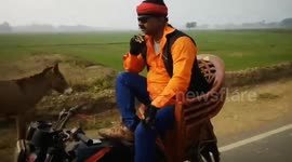 Stunt man Raise fund doing stunts in motorcycle