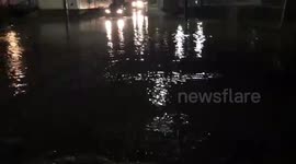 Cars Driving Through Flooded Intersection In California PA