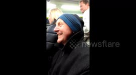 Passengers on crowed train start singing