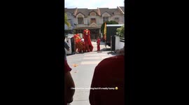 Lion Dance dancers scare themselves with firecrackers