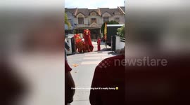 Newsflare Edit - Lion Dance dancers scare themselves with firecrackers