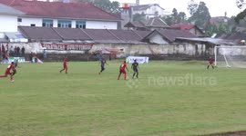 Kick the ball into the side of the goal