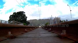 Steam Train crossing bridge, view from underneath