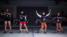 Norway curling team attempts to put on dotted trousers hands-free on ice