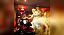Dancing dragons wow diners in London's Chinatown
