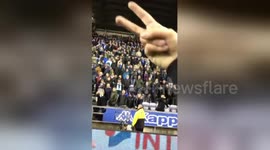 Wigan fans enter the pitch after defeating Manchester City in FA Cup