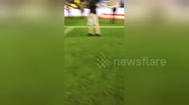 CLEAN: Wigan fans enter the pitch after defeating Manchester City in FA Cup