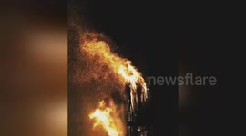 Newsflare Edit - Gothic Castle in fire. Art object made of branches. This is not a church. The author of this building is an architect so he build a gothic construction. Old Russian tradition on Maslenitsa is to burn away constructions made of seasoned br