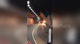 Car engulfed in flames shuts down tunnel in London