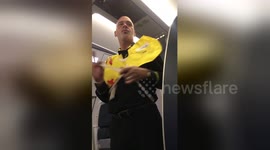 Flight attendant breaks out into 'Leaving on a Jet Plane' during safety demo