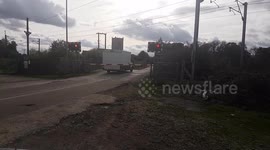 Level crossing incident. Van stuck between barriers on high speed railway line