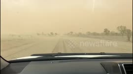 Car drives into dust storm in Queensland