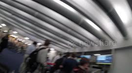 Kids and dad receiving our flight tickets