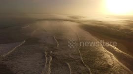 Drone captures beautiful foggy sunrise in Northern Ireland coast