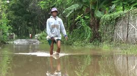 kenad breaks through flood, motorcycle owned by residents jammed