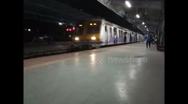 Helpless Dog running behind trains at Kanjurmarg Station,  Mumbai India.