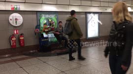 Busker and puppets musician on london tube