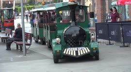 Noddy train heading through city centre