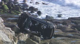 Car plunges off cliff in Dorset trapping driver inside