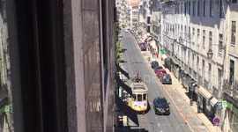 Lisbon tram tailgates dawdling car