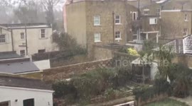 Back yards in London dusted by swirling snow flurries