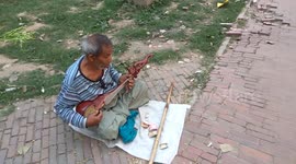 Blind old man sing a song in Dhaka