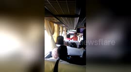 Newsflare Edit - Bus driver and conductor fighting in front of passengers