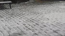Heavy snow pathway in London mews