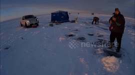 Slipping on the ice while ice fishing