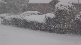 Brave man walking in heavy snow fall