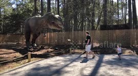 Toddler Meets Life-size Tyrannosaurus Rex. Priceless Reaction
